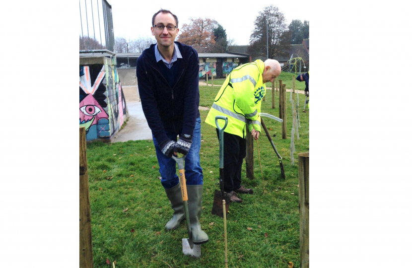 Cllr Dahmash planting a tree